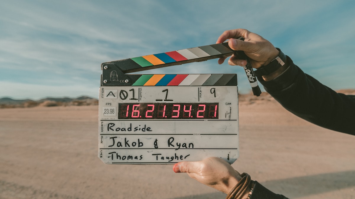 Film clapperboard on a desert road during golden hour — practical guide to sharing video files without compression or platform re-encoding